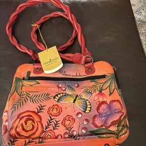 New with tags. Anuschka pink and red Floral and Butterfly Shoulder Bag